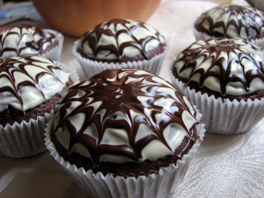 Halloween chocolate muffins with spider web
