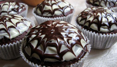 Halloween chocolate muffins with spider web