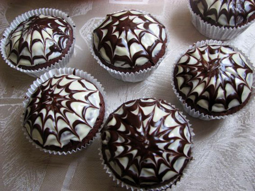 Halloween chocolate muffins with spider web